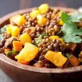Lentilsaladinasmallbrownwoodenbowl