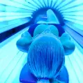 womaninatanningbedwithbluelight
