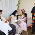 MiguelBellaandtheirdaughterattheirweddingheldatSalemHospitalsoncologyunit