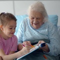 Transitionalcareswingbedelderlywomanvisitedbygranddaughter